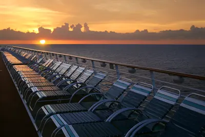 Deck chairs at sunset