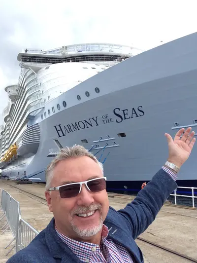 Captain Johnny in front of Harmony of the Seas