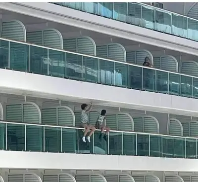 Kids on a cruise ship railing