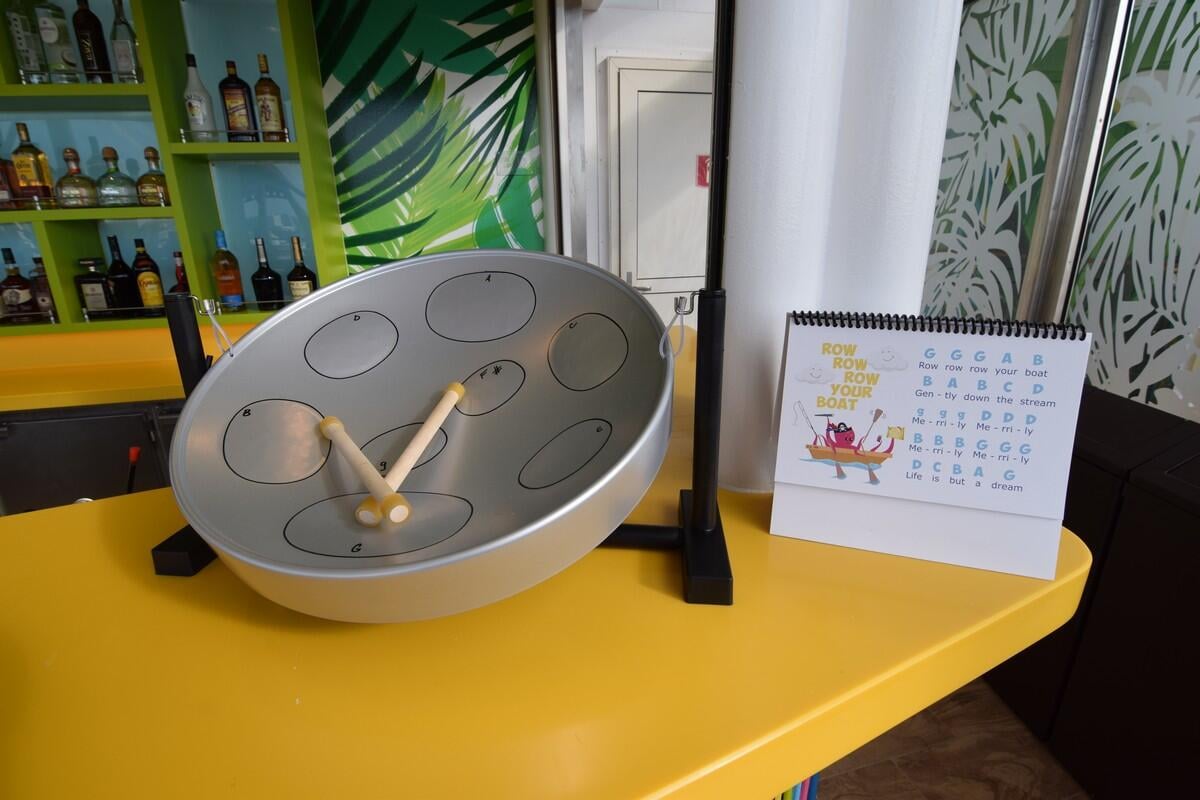 Royal Caribbean testing family steel drum lesson activity Royal