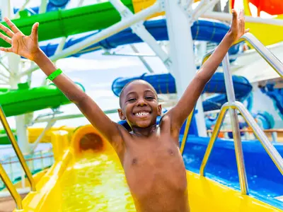 Boy after riding water slide on Mariner