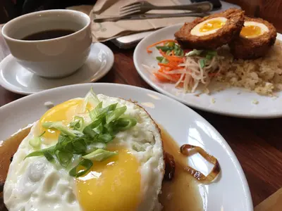 Scottish egg encased in longanisa and a loco moco with adobo gravy