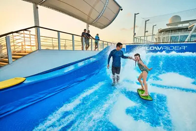 Guest and crew member on FlowRider