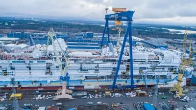 Side of Icon of the Seas at shipyard