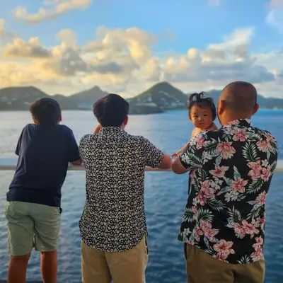 family enjoying cruise balcony view