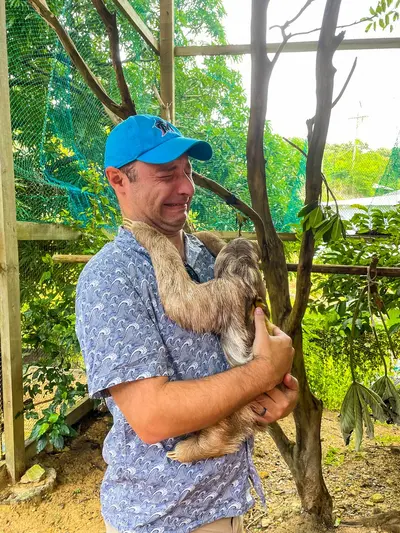 Matt holding a sloth