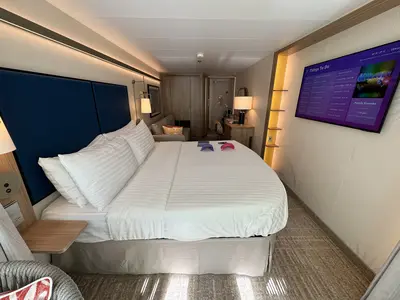 Spacious Infinite Central Park Balcony Cabin king bed on Icon of the Seas