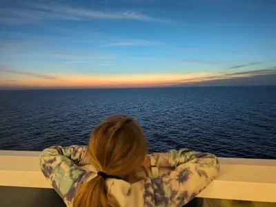 Daughter looking out infinite window