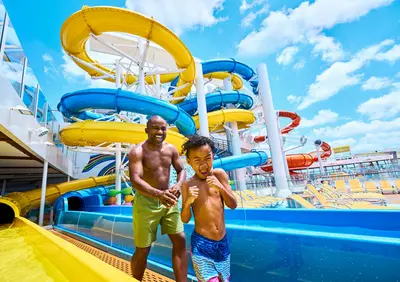 Father and son on water slides