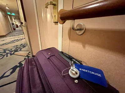 AirTag on luggage in hallway