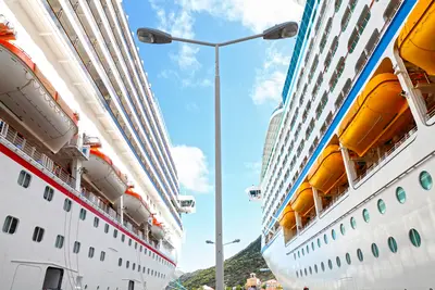 Two cruise ships docked side by side