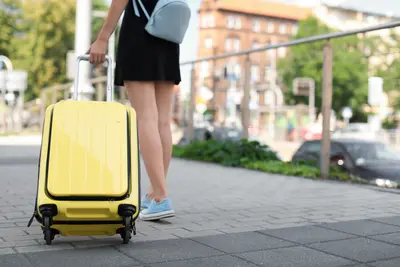 Woman with carry-on suitcase