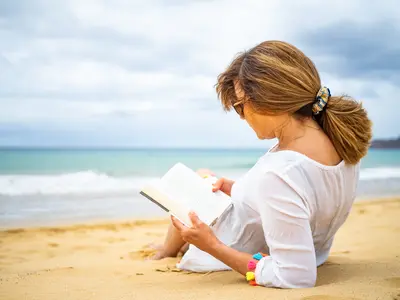 Woman reading on a beach