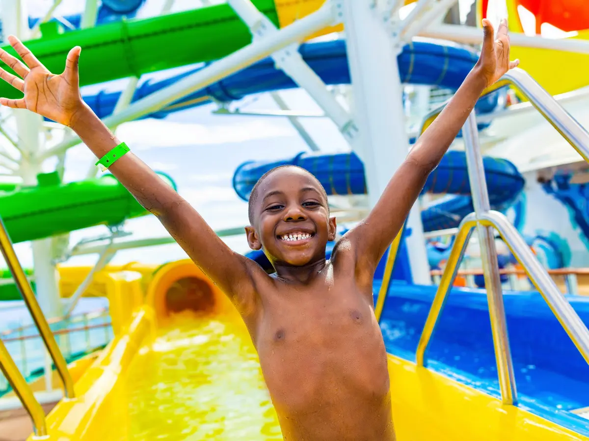Boy after riding water slide on Mariner