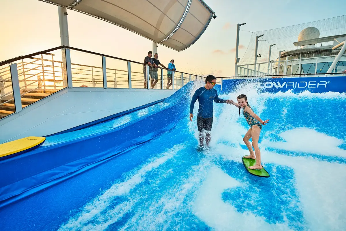 Guest and crew member on FlowRider