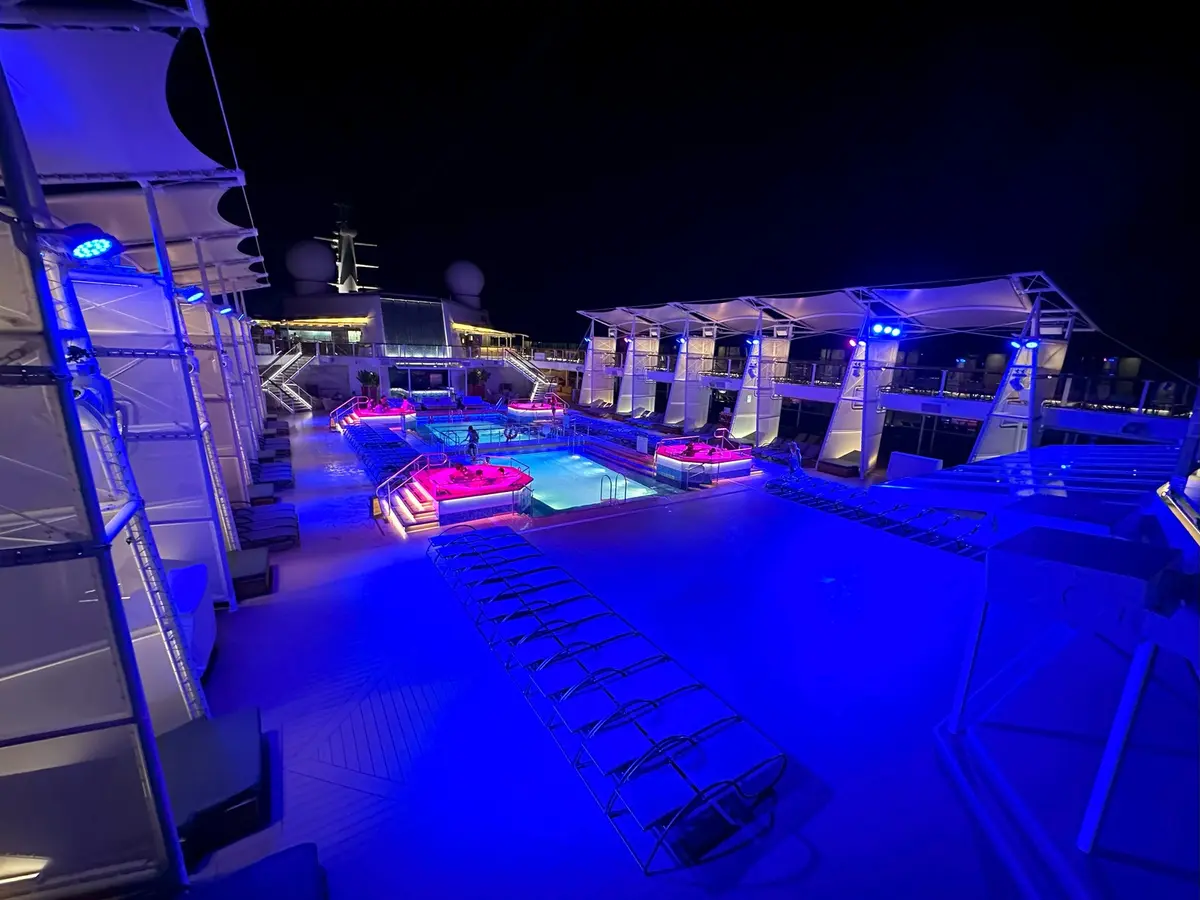Pool deck at night on Celebrity Reflection