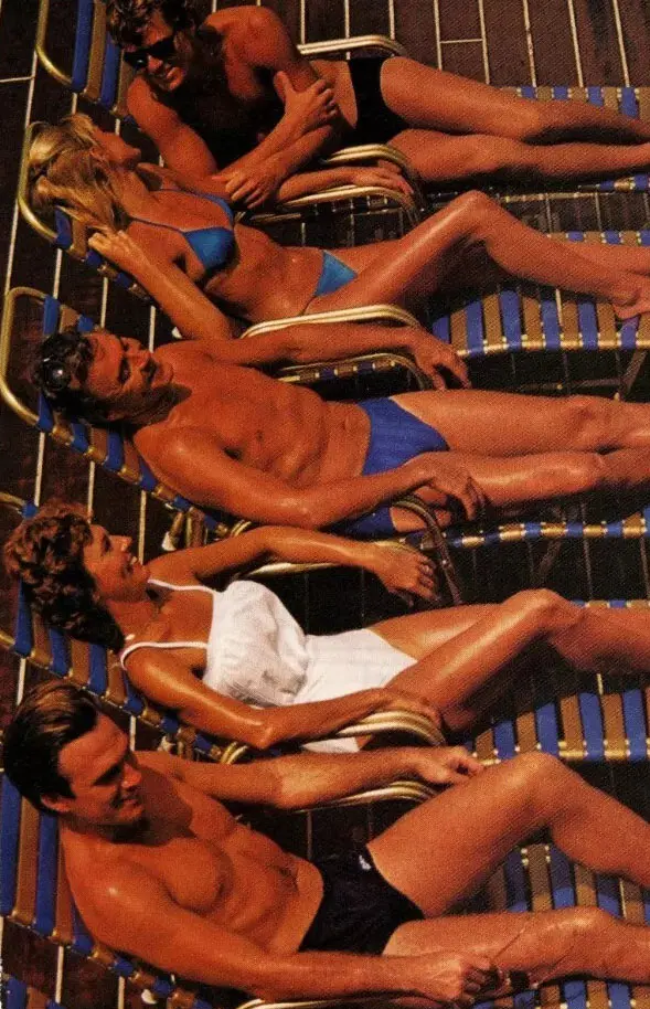 People on pool loungers