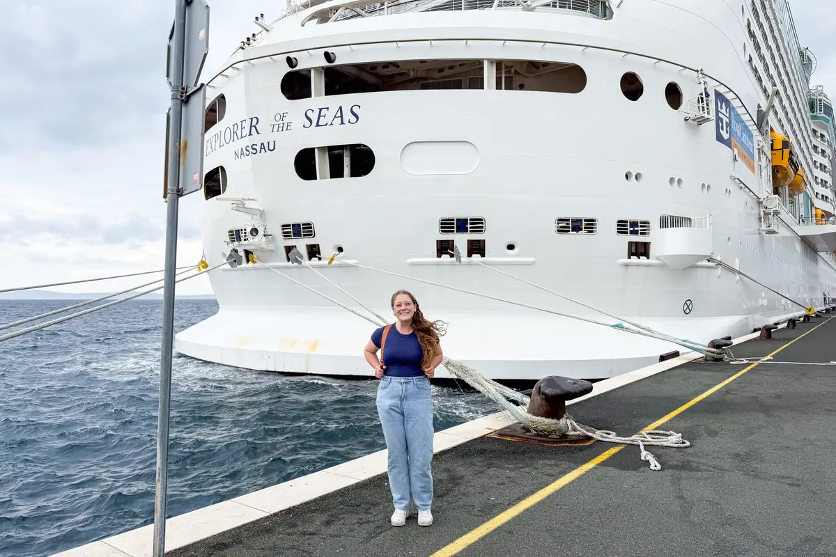 Jenna smiling in front of Explorer of the Seas