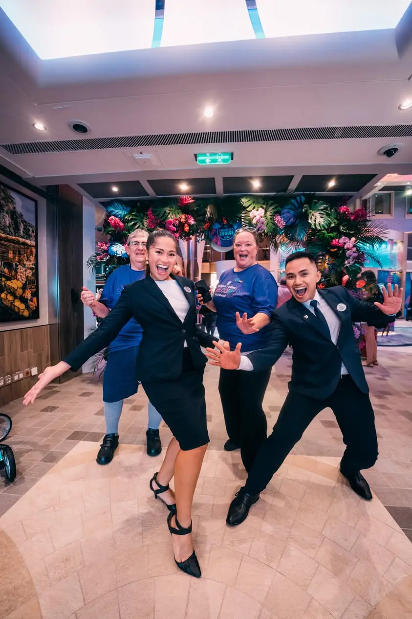 Crew members welcoming guests