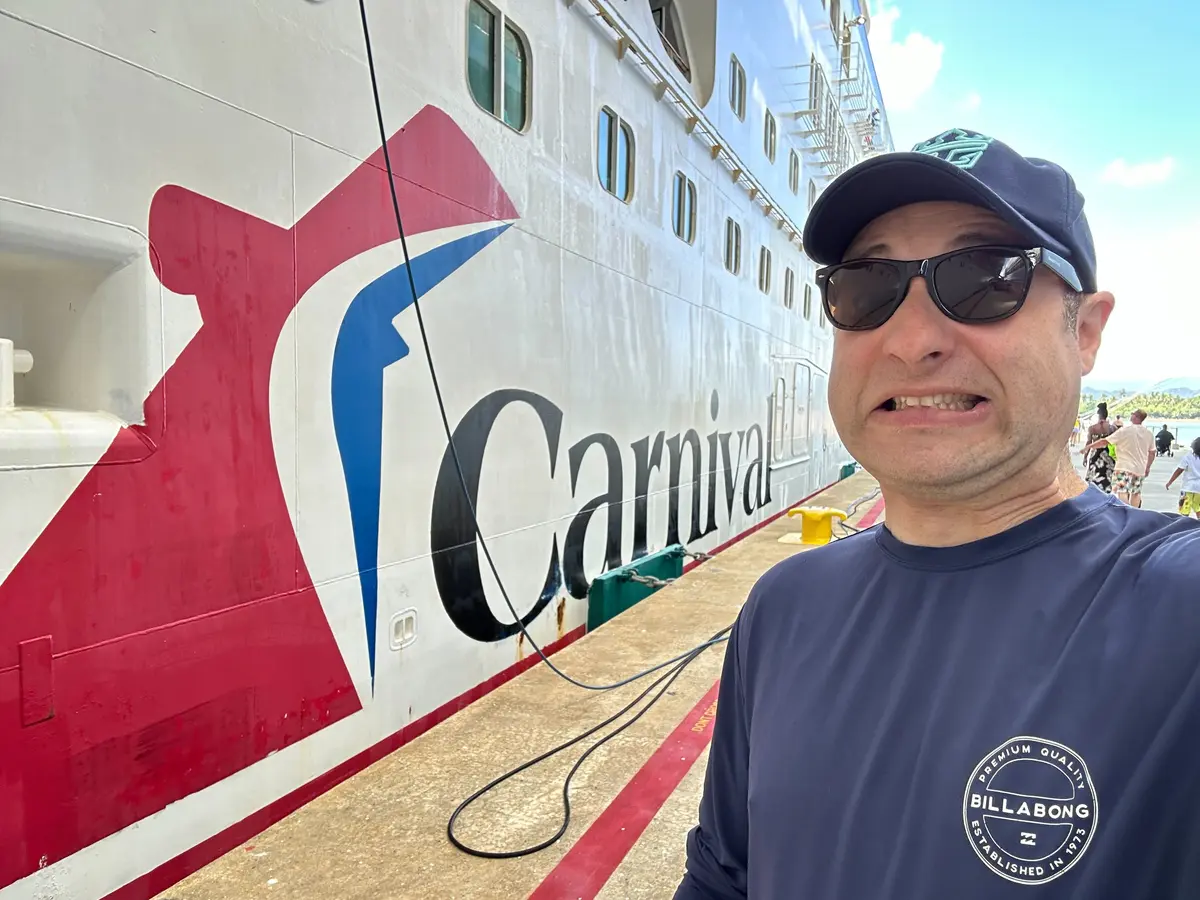 Matt next to a Carnival ship