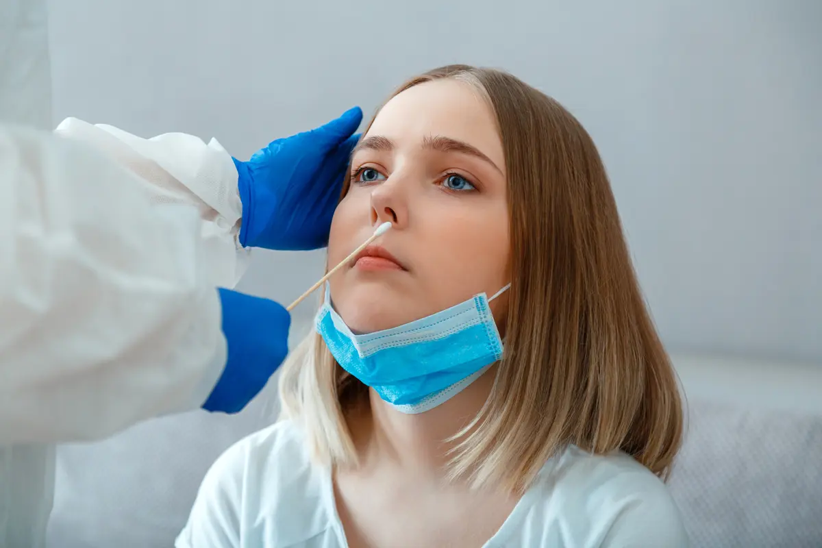 Woman taking covid test